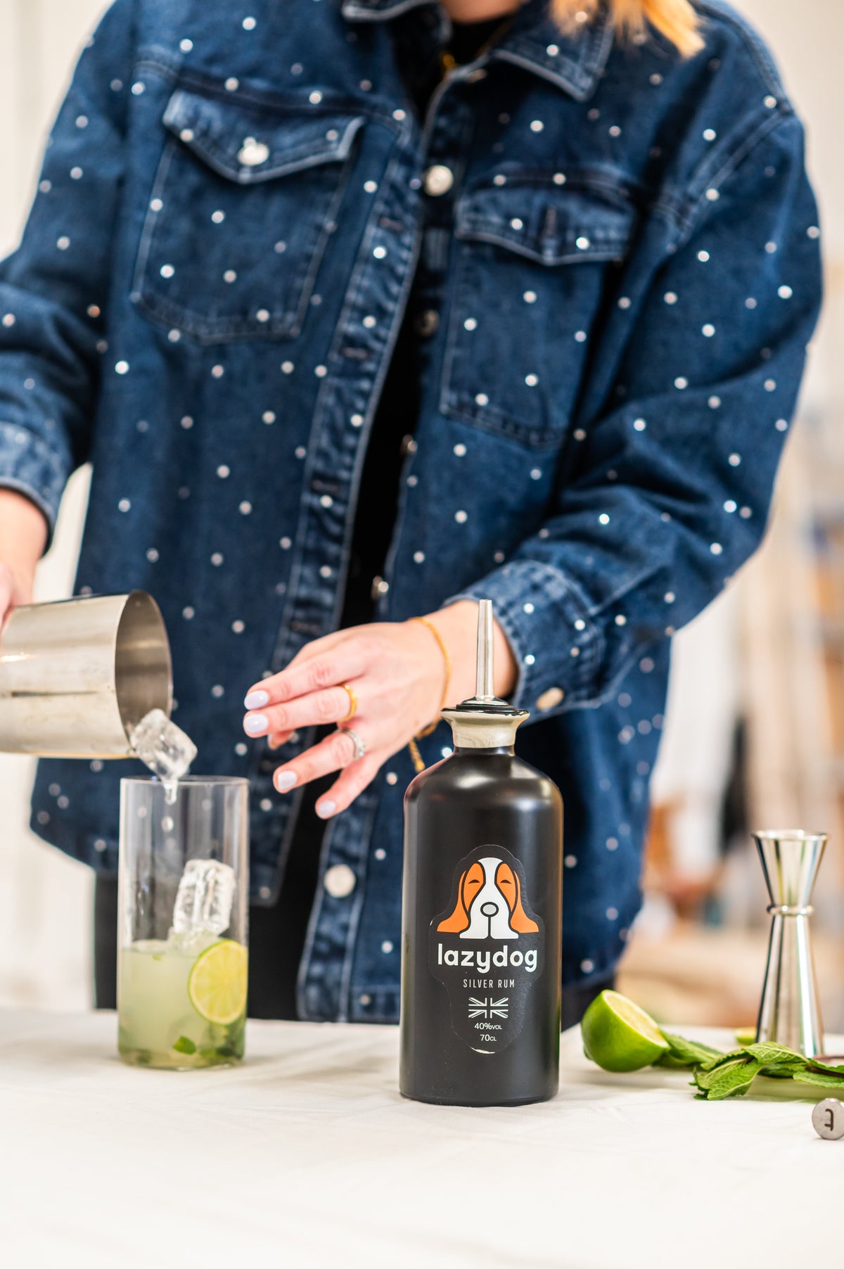 Current Lazydog Silver Rum being used to make a fresh lime and mint cocktail