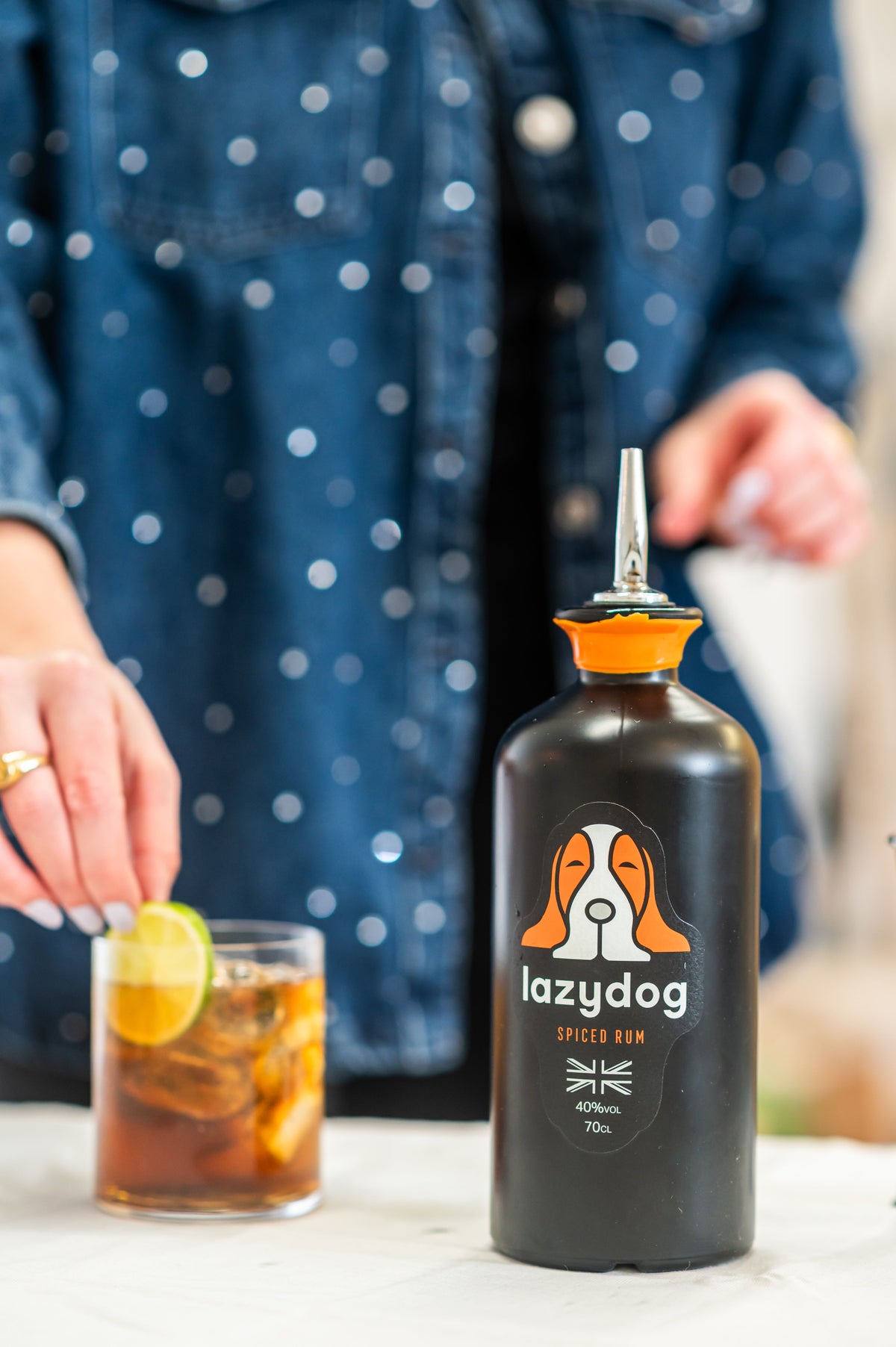Current Lazydog Spiced Rum served with ice, mixer and lime
