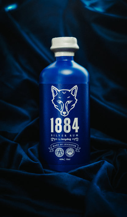 Original photograph of 1884 Silver Rum, blue 70cl bottle with silver fox label and silver wax.